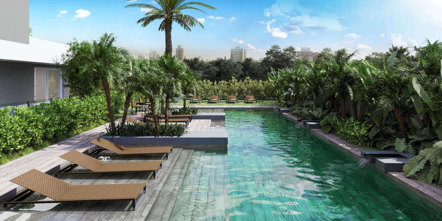 Piscina ampla com design moderno, ideal para lazer e relaxamento, rodeada por espreguiçadeiras e área de descanso.