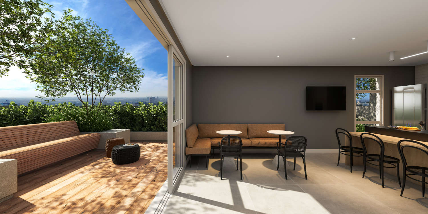 Rooftop gourmet sofisticado, com área de convivência, espaço para churrasco e vista panorâmica da cidade.